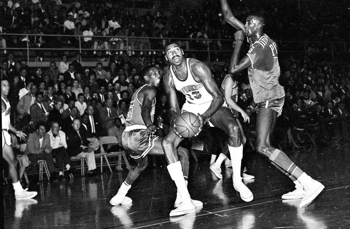 Oct. 26, 1962: Wilt Chamberlain of the San Francisco Warriors is surrounded by Detroit Pistons during the team's first game in S.F. at USF’s War Memorial Gym.