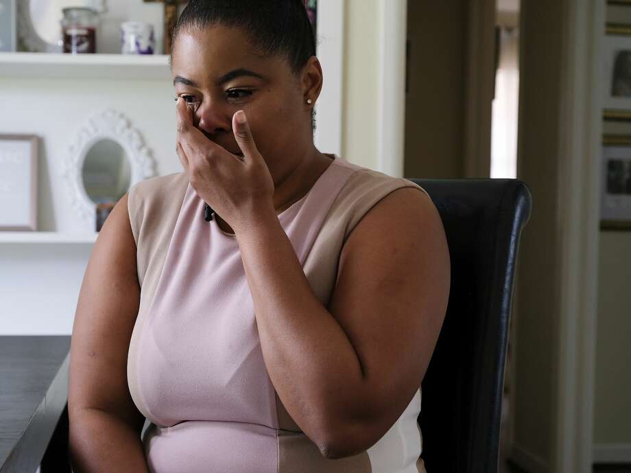 Ajshay James cries as she recalls being separated from her daughter at Texas Children's Hospital more than two years ago. Photo: Elizabeth Conley/Staff Photographer