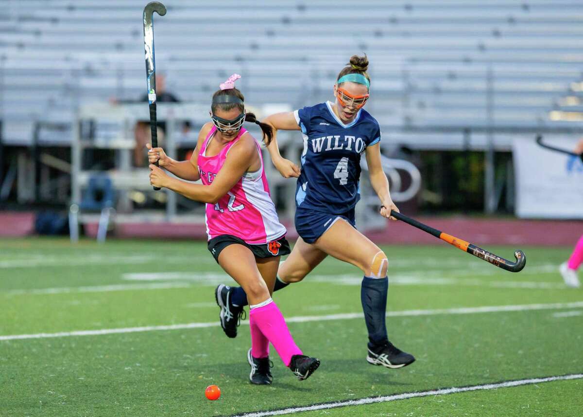 Action during Wednesday's field hockey game between Ridgefield and Wilton.