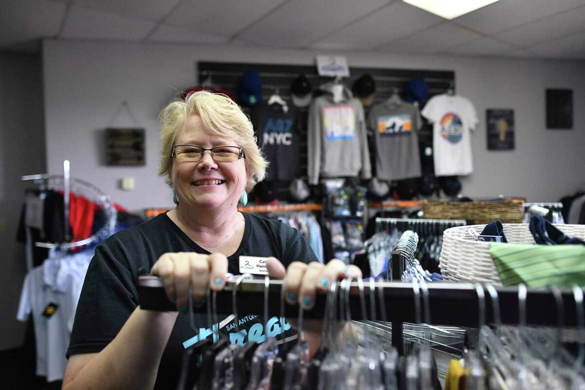 Cathy Hamilton smiles as she takes a quick break in her shop, San Antonio Threads, a charity where children and teens who are in foster care or are homeless can get new clothes and shoes for free. Hamilton started the nonprofit to help kids build self-confidence. As a victim of abuse when she was a teen, Hamilton knows the importance of retaining dignity in difficult times.