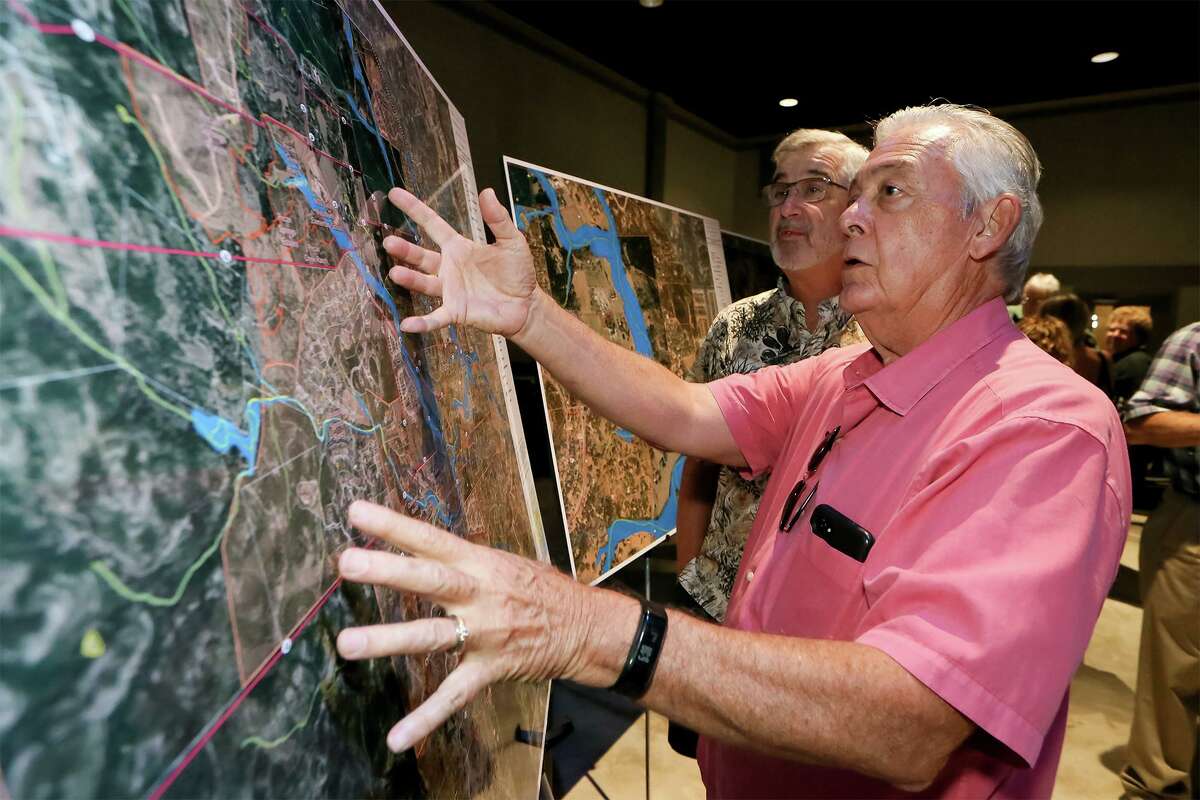 Scenic Loop Canyons residents David Clark, right, and Ken Kempf, look at proposed options on a map at the CPS Energy open house on the proposed Scenic Loop Substation and Transmission Line Project to talk to residents and gather input at the Cross Mountain Church Student Center on Thursday, Oct. 3, 2019. Five possible sites have been proposed for the new substation in the Scenic Loop area of Northwest Bexar County to serve growth areas west of Leon Springs.