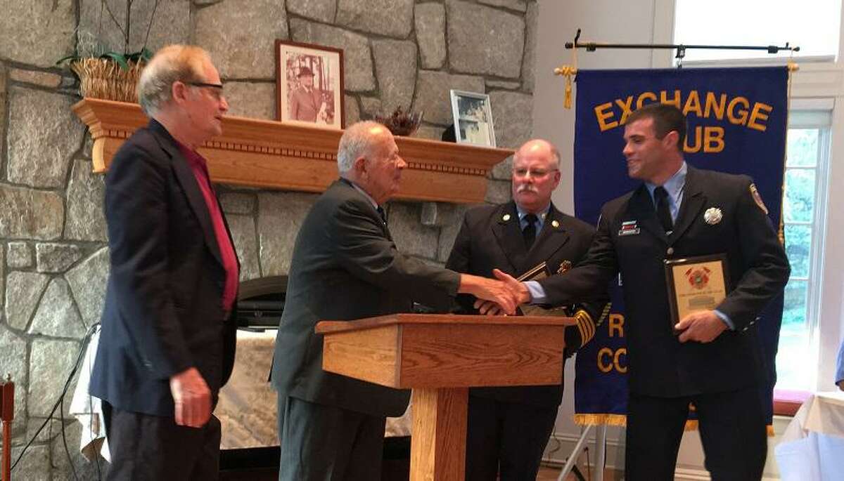 Ridgefield Firefighter Edward Marchitto, right, was lauded for his exceptional services at the Exchange Club of Ridgefield’s Appreciation Buffet at the Leir Retreat Center on Oct. 2.