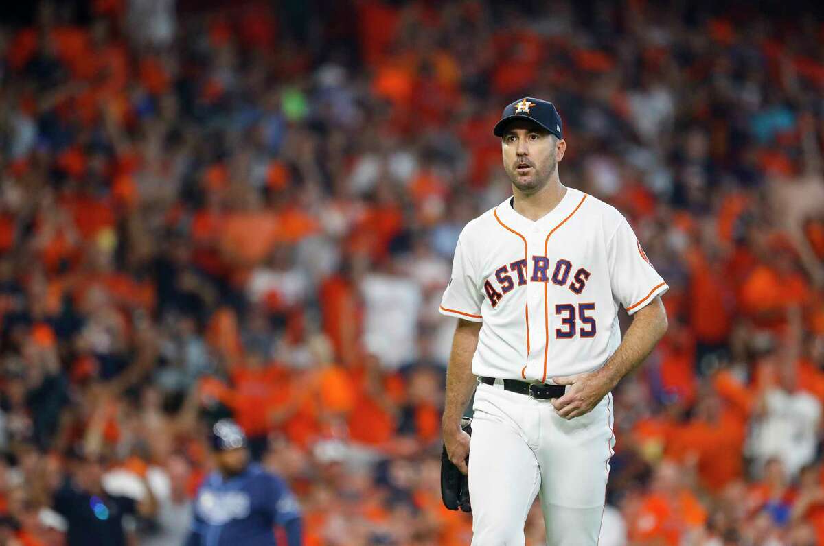 Houston Astros starting pitcher Justin Verlander (35) walks back to the dugout after hitless first inning against the Tampa Bay Rays during Game 1 of the American League Division Series at Minute Maid Park on Friday, Oct. 4, 2019, in Houston.