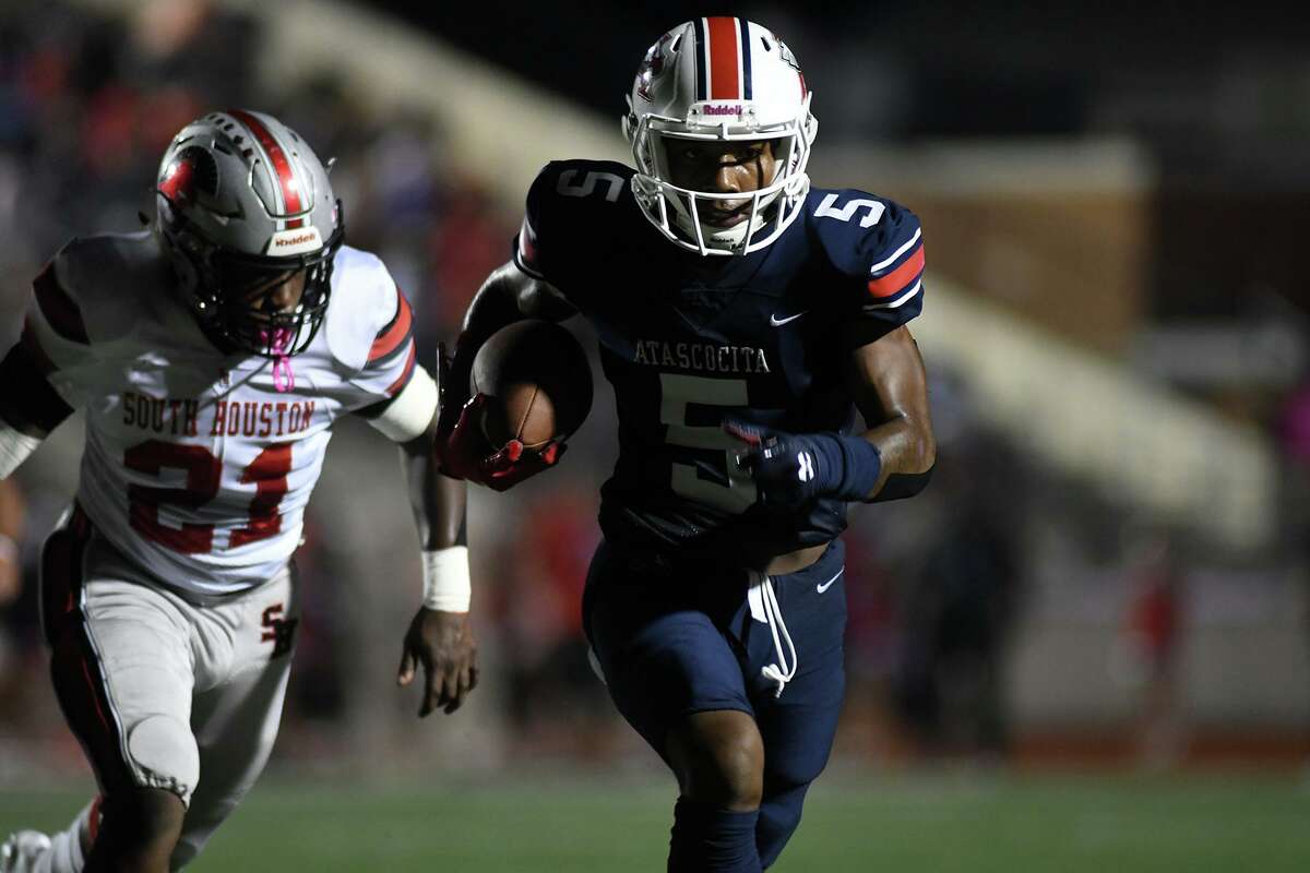 Atascocita senior running back TJ Thomas (5) breaks away from Trent Harrell (21) and the South Houston defense on a long gain in the first quarter of their District 22-6A matchup at Turner Stadium in Humble on Oct. 3, 2019.