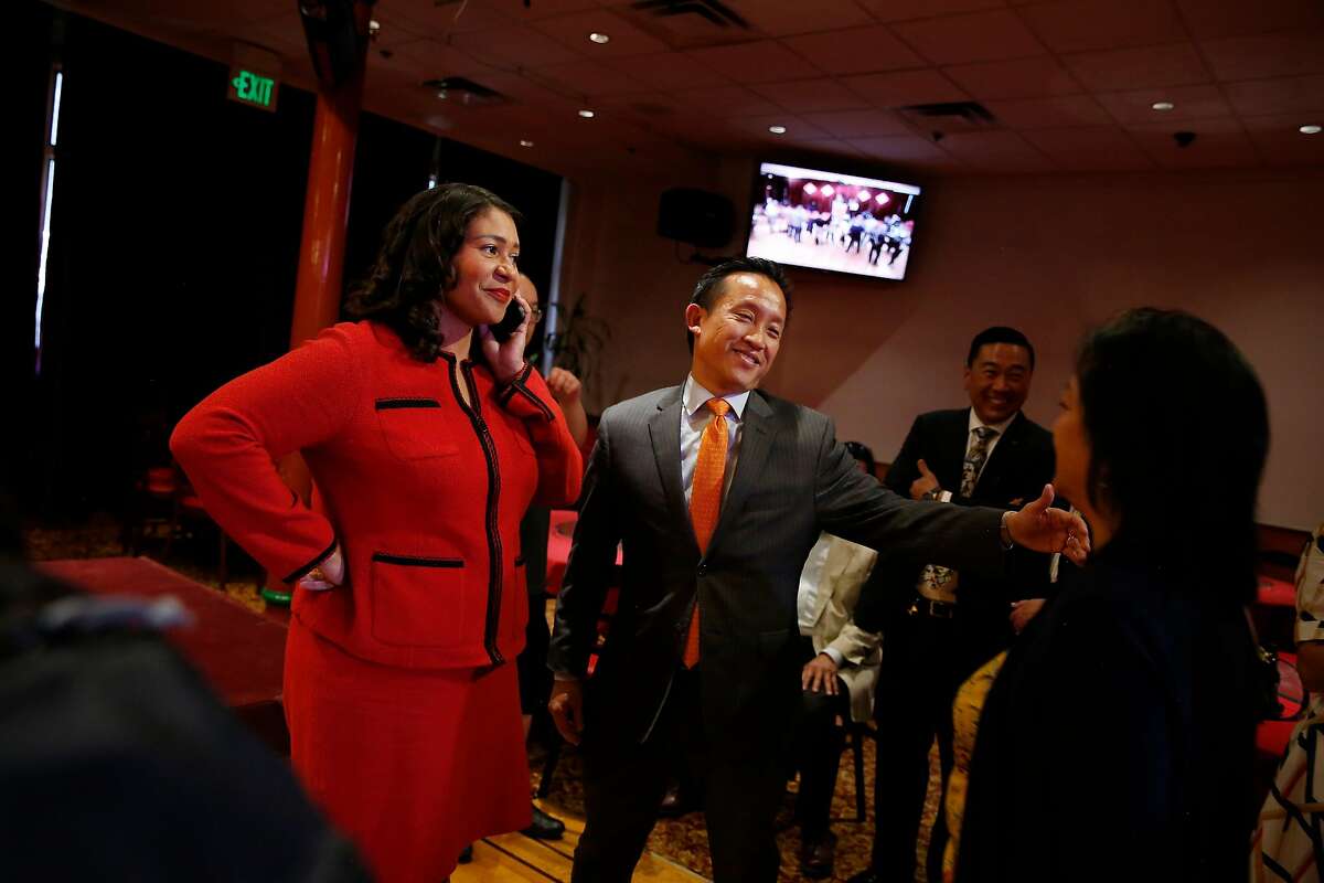 Mayor London Breed (l to r) takes a call as Assemblymember David Chiu greets an arrival at Far East Cafe before a press conference regarding the appointment of Suzy Loftus as interim district attorney on Friday October 4, 2019 in San Francisco, Calif.