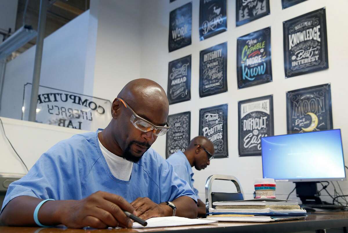 Derry Brown (left) and Richard Richardson attend a computer literacy class in the Robert E. Burton Adult School at San Quentin State Prison in San Quentin, Calif. on Thursday, Sept. 12, 2019. Burton has been designated as a "distinguished school," the first school within the California corrections system to achieve the honor.
