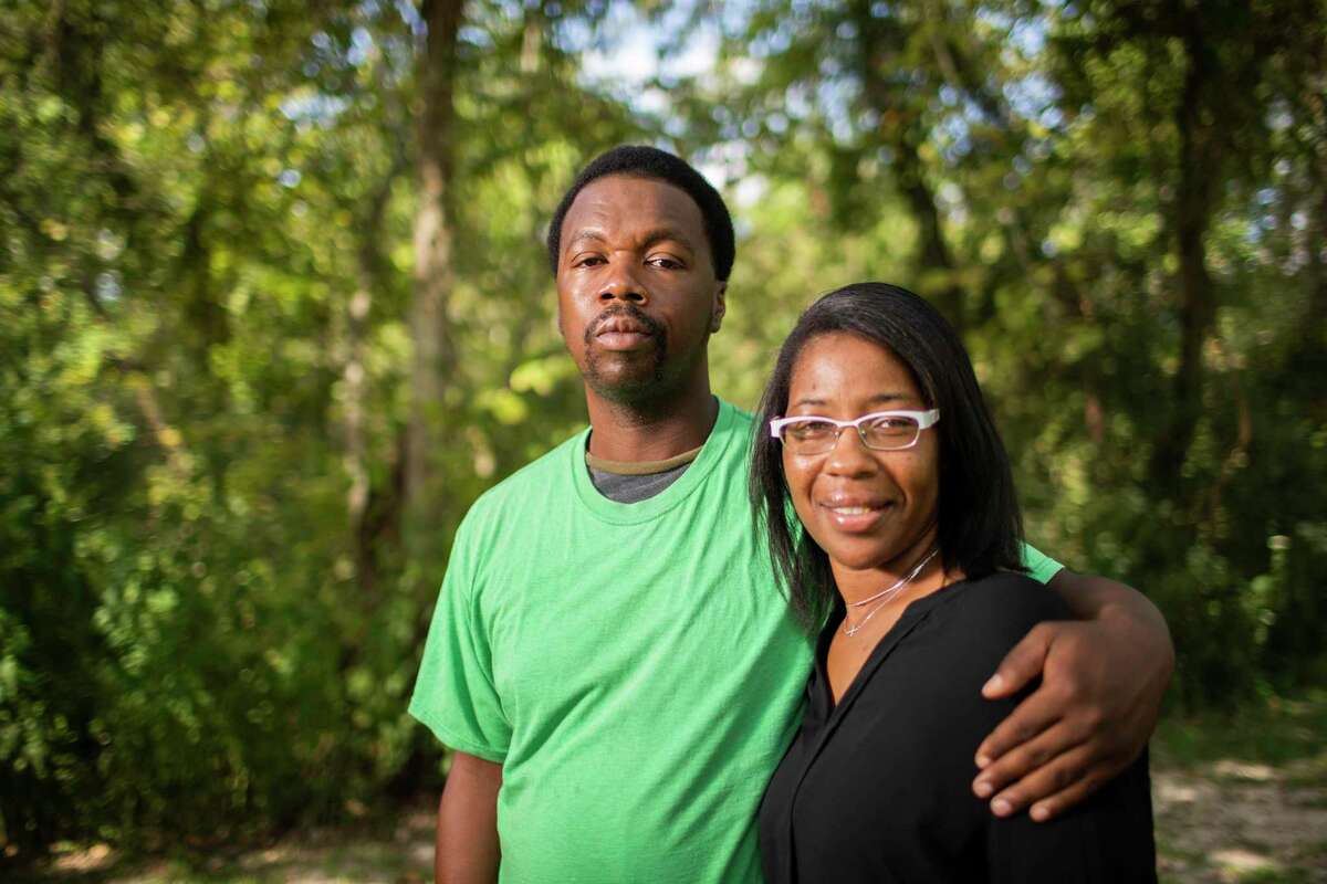 Donald Neely, 43, and his sister Taranette Neely, 42, stand together. Donald Neely was formerly homeless and arrested in Galveston in August for trespassing and clipped to a rope line held by two mounted police officers. A