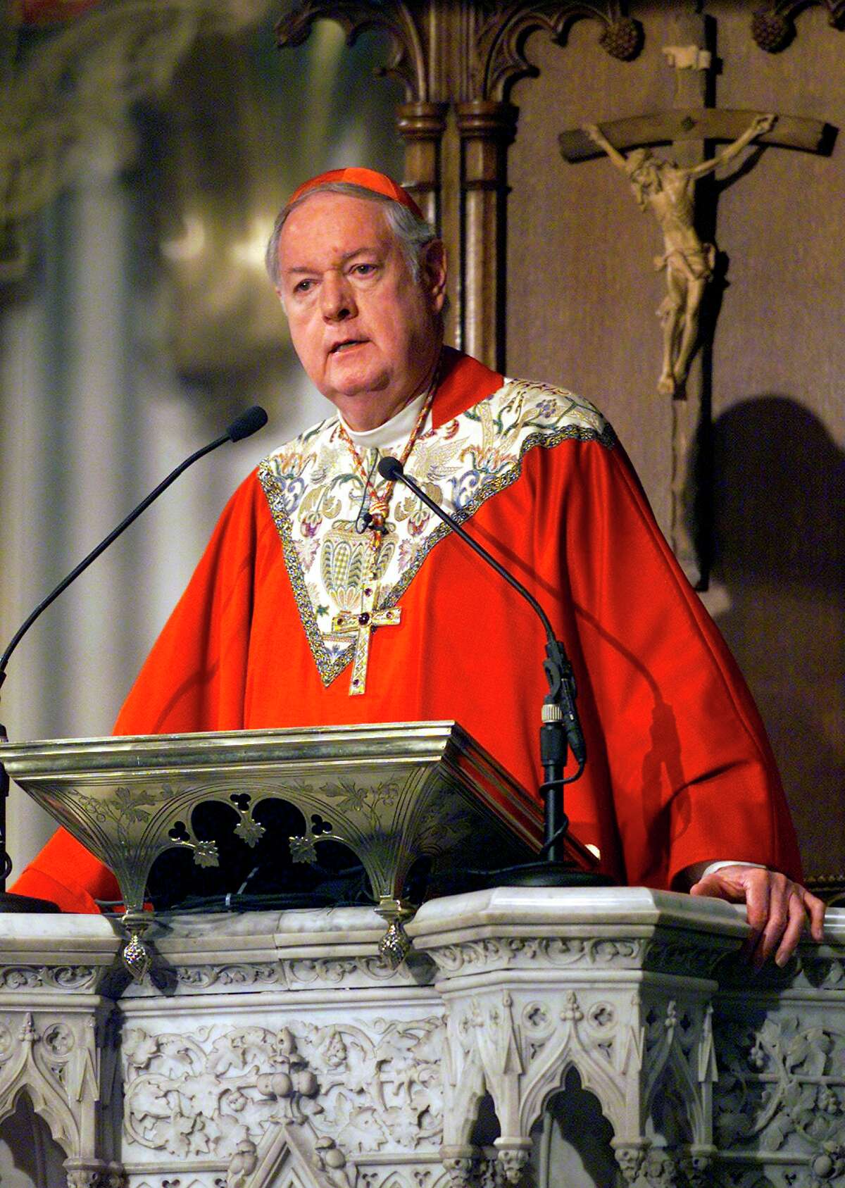 Cardinal Edward Egan of the New York archdiocese speaks during a Palm Sunday mass at St. Patrick’s Cathedral in New York City, March 24, 2002.