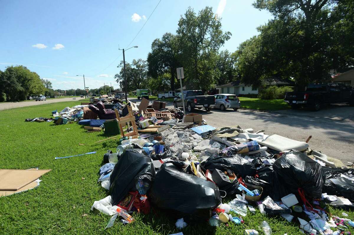 Large piles form alongside Lucas near S. 29th Street as residents throughout flooded Beaumont neighborhoods get to the work of gutting their damaged homes Tuesday. Photo taken Tuesday, September 24, 2019 Kim Brent/The Enterprise