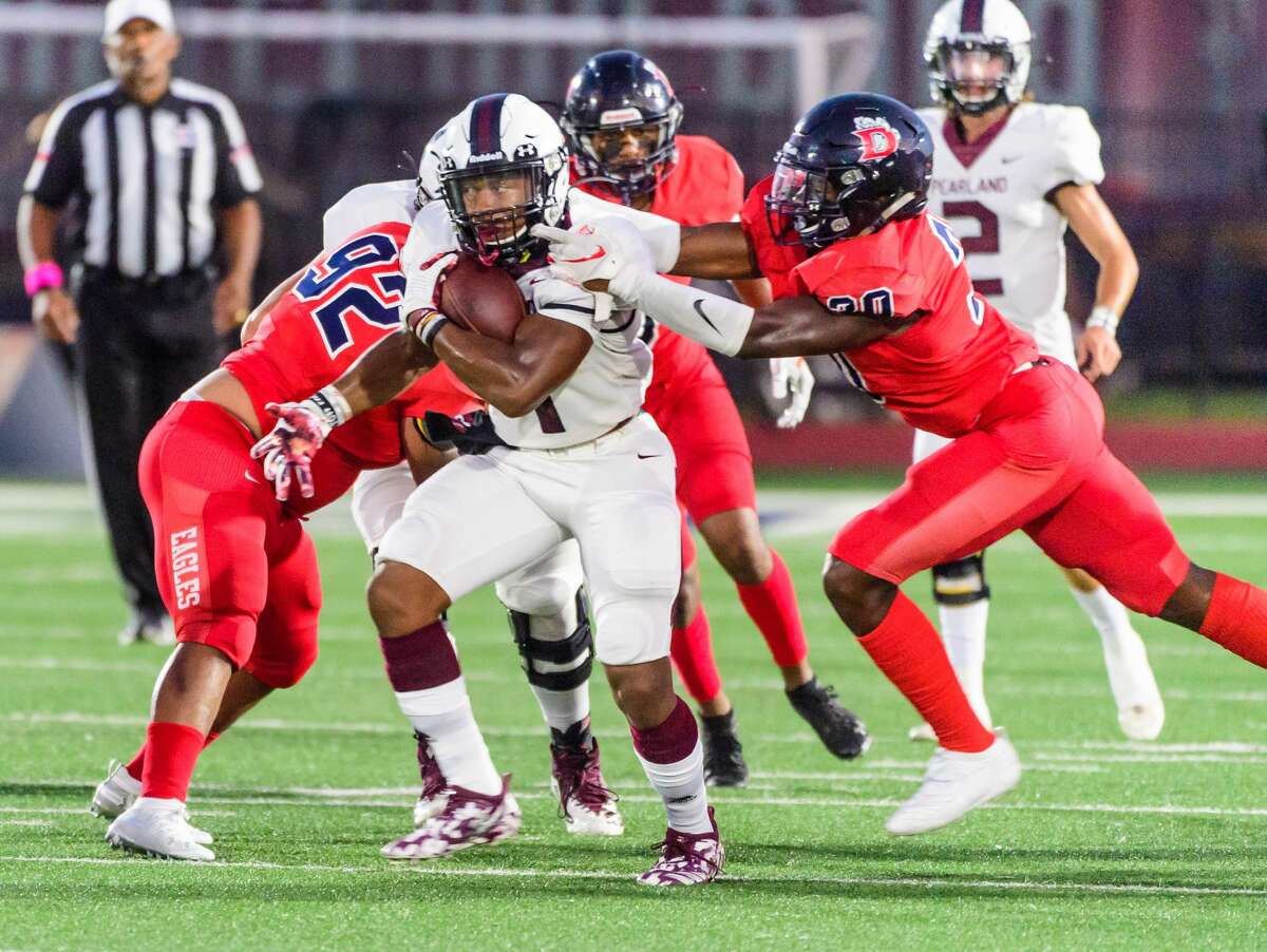 Pearland #7 Brandon Campbell tries to move past Dawson's defense during the Dawson vs Pearland football game at The Rig/Pearland stadium, Pearland, TX, Oct. 4, 2019