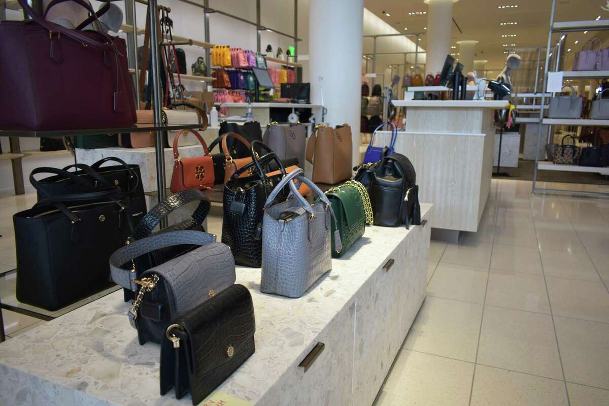 A handbag display at the Nordstrom SoNo Collection store in Norwalk, Conn., slated to open Oct. 11. Nordstrom carries bags from Norwalk-based Dooney & Bourke and apparel from Vineyard Vines, based in Stamford, among other Connecticut companies.