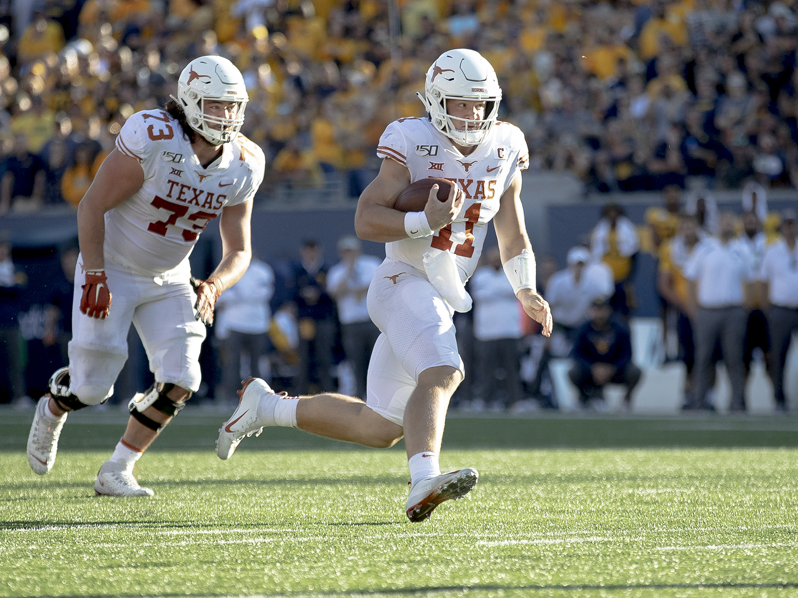 Ehlinger leads No. 11 Texas over West Virginia 42-31