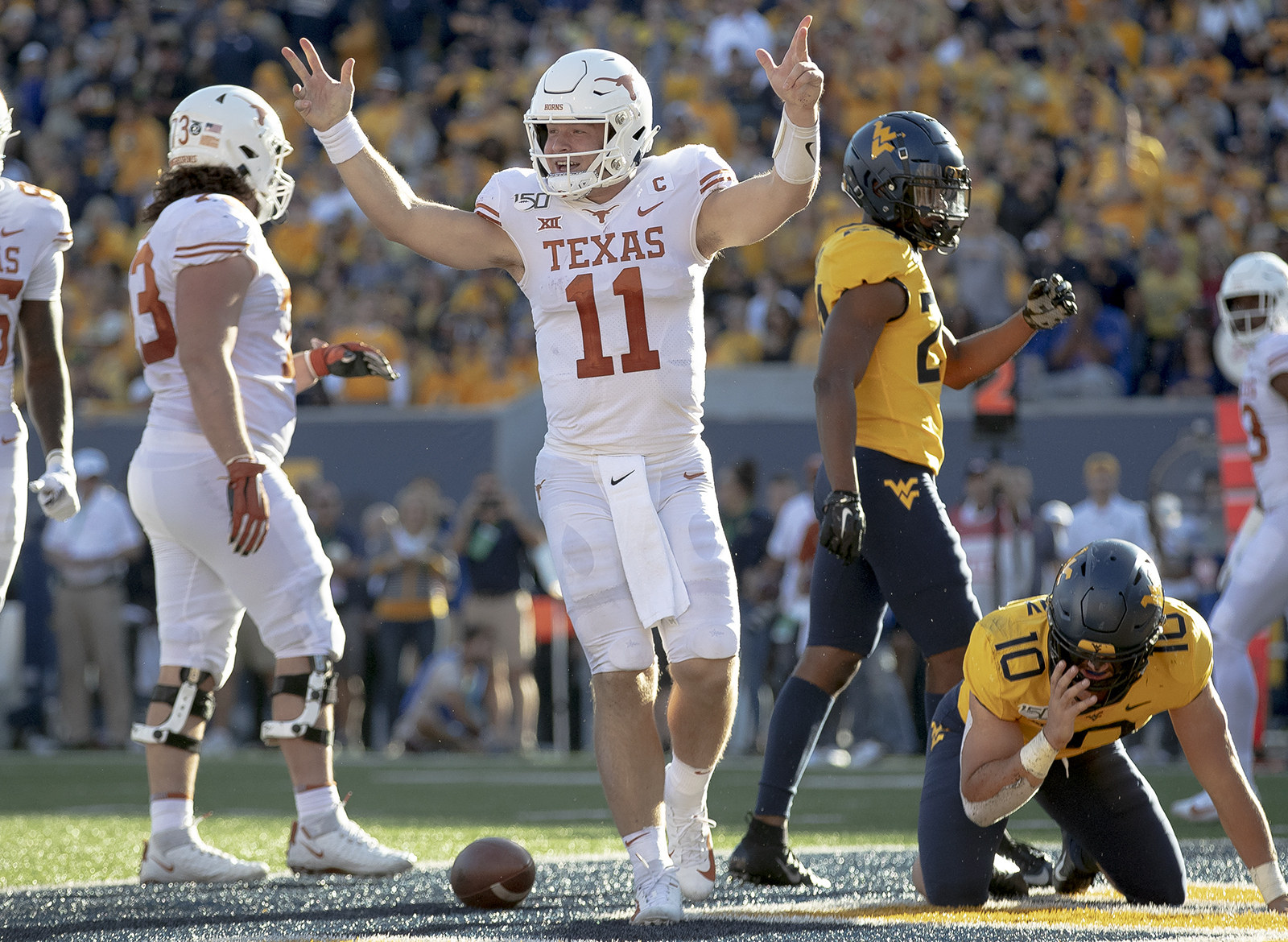 Texas managed to fend off a feisty West Virginia team on the road thanks to...