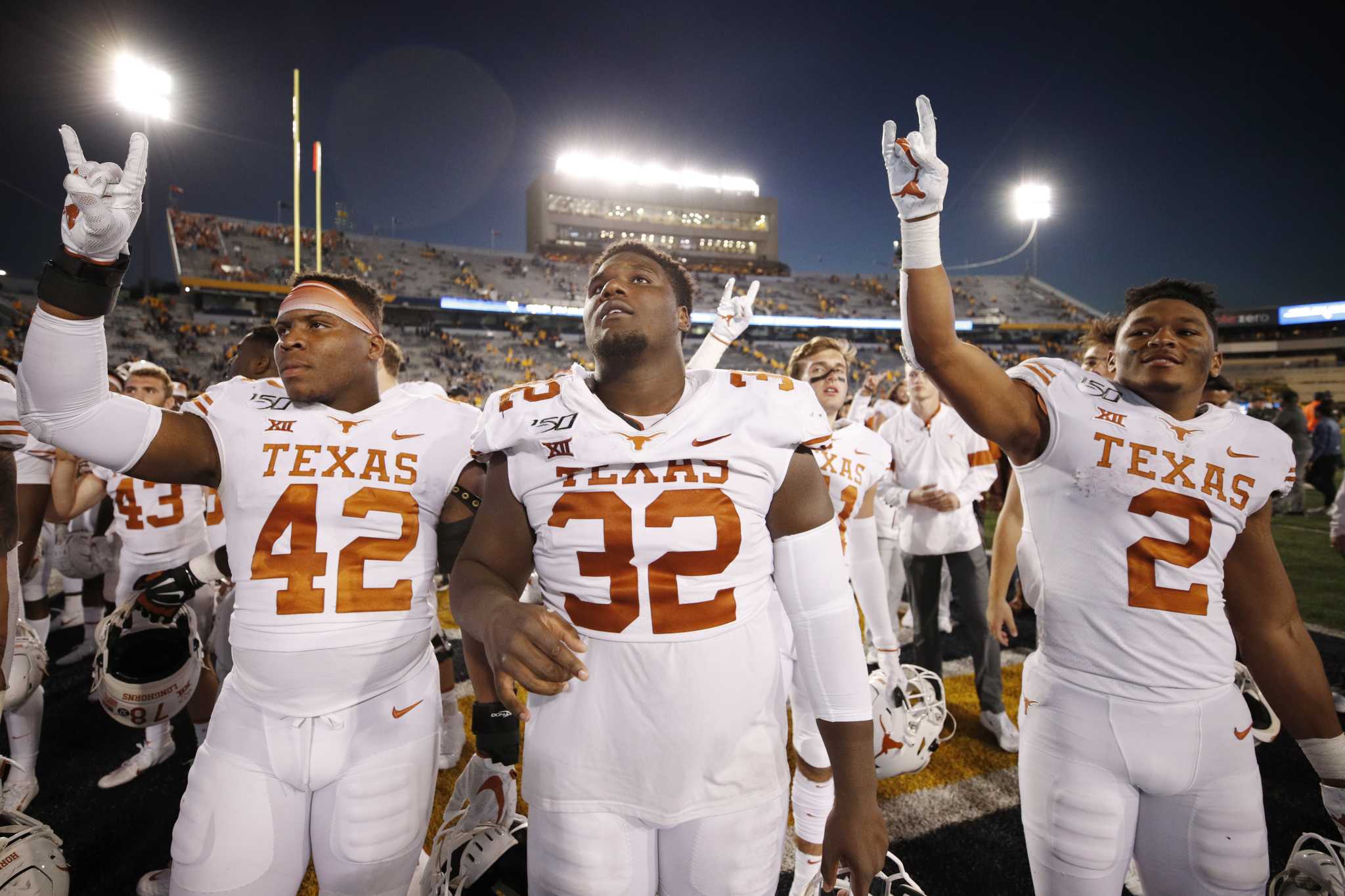 Ehlinger leads No. 11 Texas over West Virginia 42-31