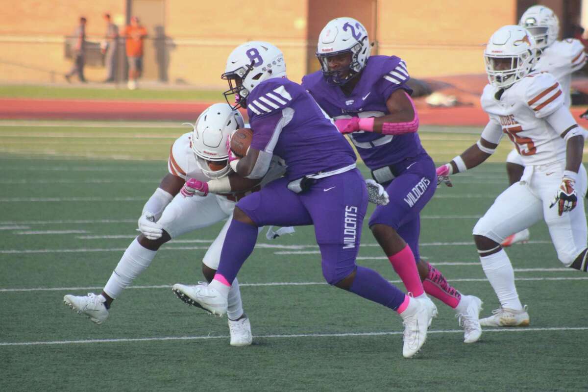 Dobie's Johnathan Baldwin slows down Humble's Syn'Savier Sidney in first-half action Saturday. The Longhorns' run defense was superb all night long.