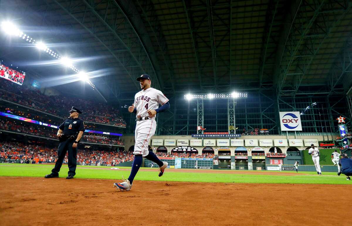 Houston Astros center fielder George Springer (4) runs back to the dugout before the start of Game 2 of the American League Division Series at Minute Maid Park on Saturday, Oct. 5, 2019, in Houston.