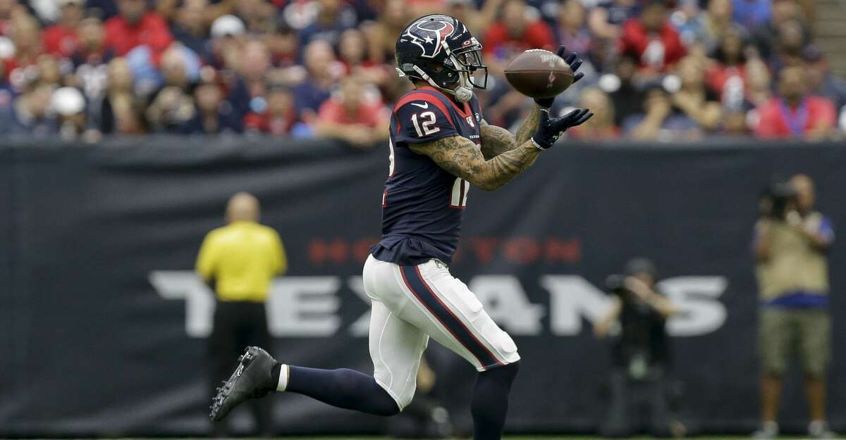 Houston Texans wide receiver Kenny Stills (12) makes a catch against the Carolina Panthers during the first quarter of an NFL game at NRG Stadium Sunday, Sept. 29, 2019, in Houston. Stills got hurt on this play. The Panthers won 16-10.