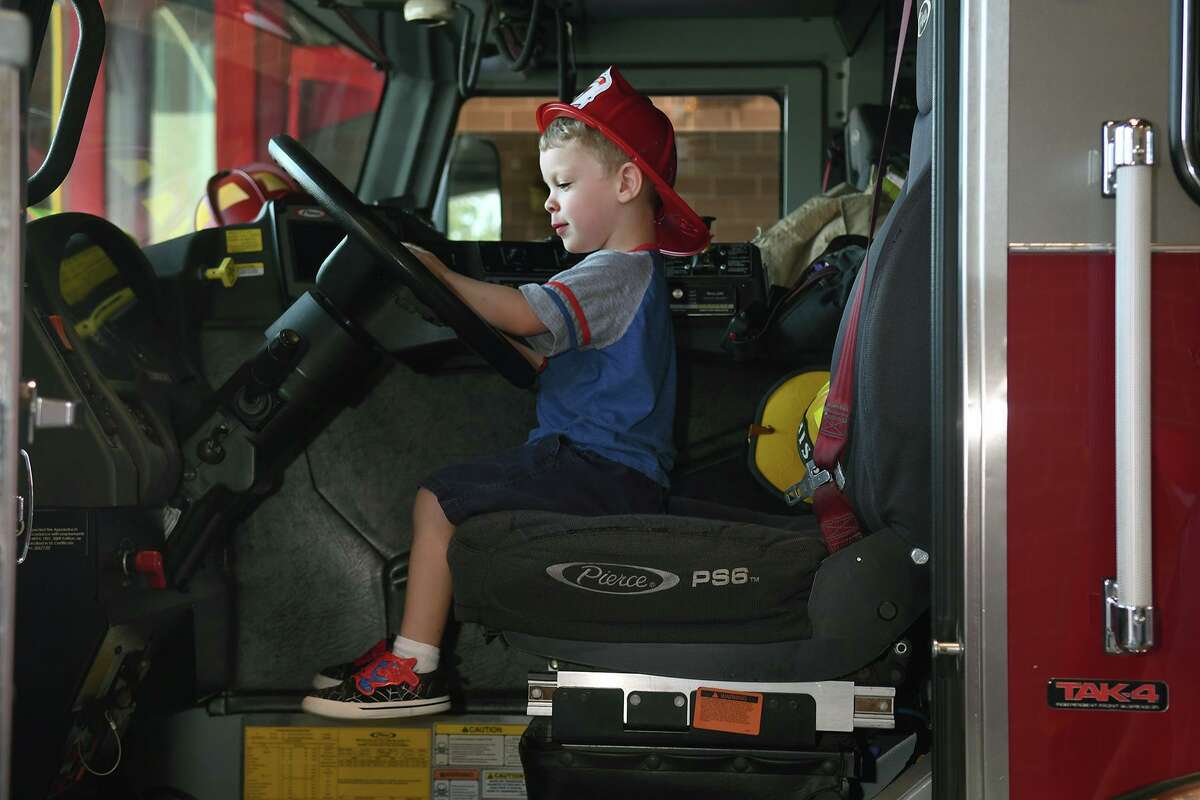 Jaxon Bruce, 3 1/2, tries out the driver's seat on Engine 74 during the grand opeing of Station 74, located at 23803 Aldine Westfield on Oct.5, 2019.
