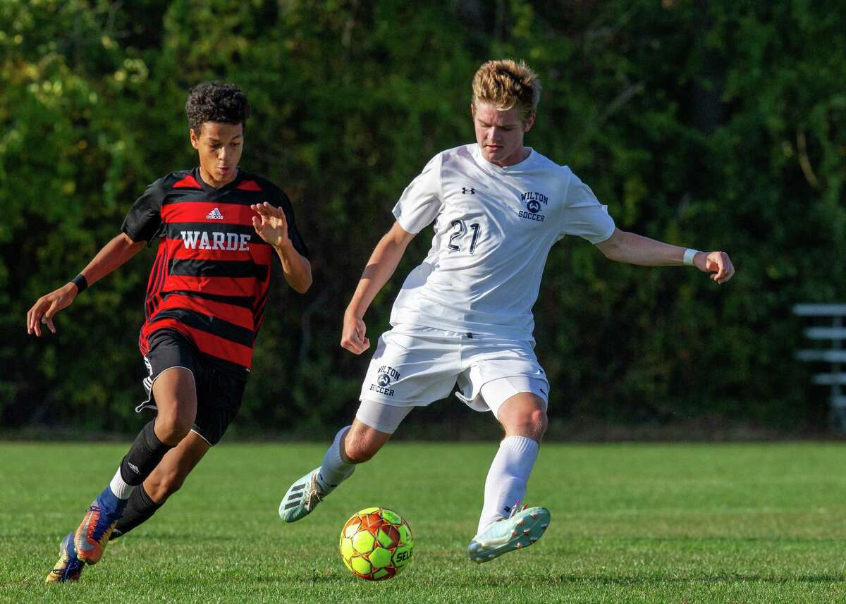Parker Ward (right) and the Wilton boys soccer team are 6-0-2 following Saturday's 3-0 win over Danbury.