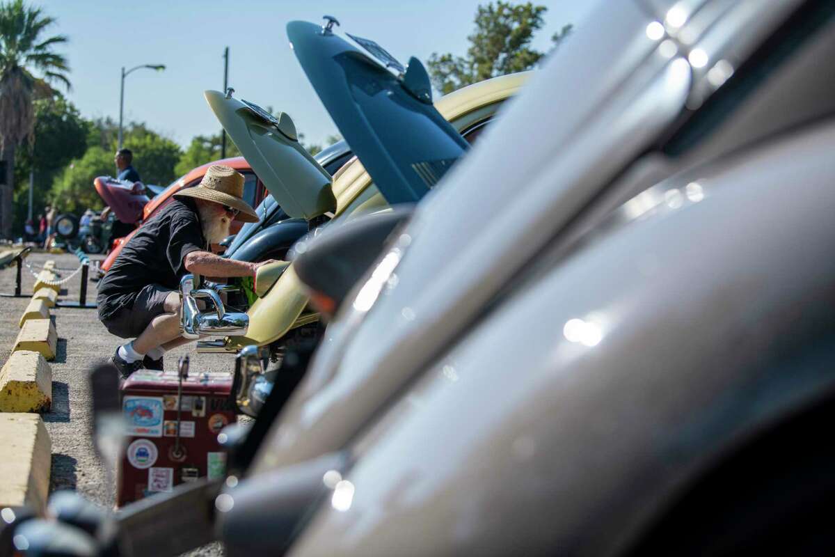 Paul Smith cleans his 1956 Bug during an Oktoberfest car show hosted by Volkswagen Owners of San Antonio and South Central Texas on Sunday, Oct. 6, 2019.