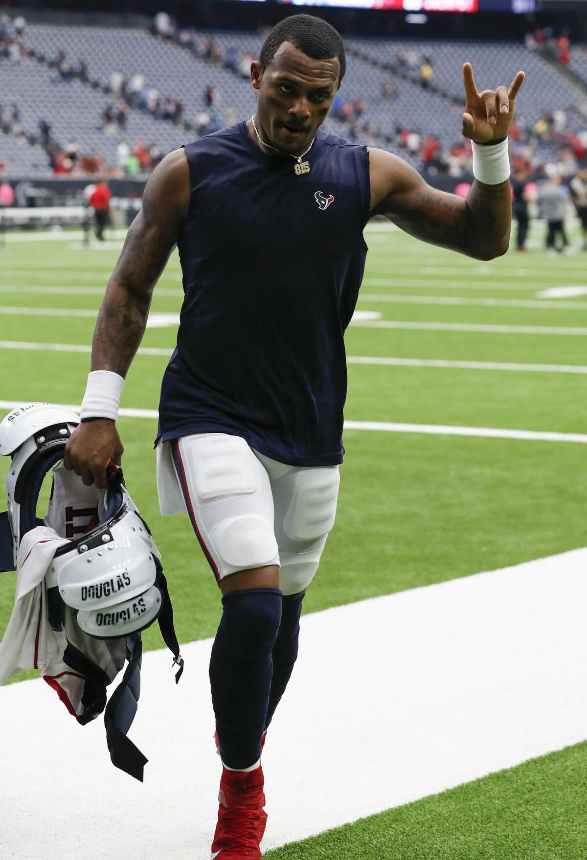 Houston Texans quarterback Deshaun Watson waves to the fans as he leaves the field following the Texans' 53-32 win over the Atlanta Falcons in NFL football game at NRG Stadium on Sunday, monthnameap} 6, 2019, in Houston.