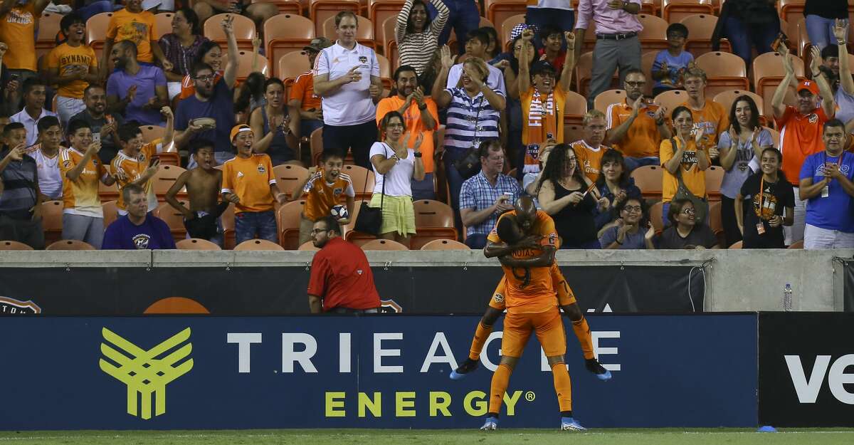 Houston Dynamo forward Mauro Manotas (9) celebrates with midfielder DaMarcus Beasley (7) after scoring a goal against Minnesota United FC during the first half of an MLS match at BBVA Stadium Wednesday, Sept. 11, 2019, in Houston. The Dynamo won 2-0.