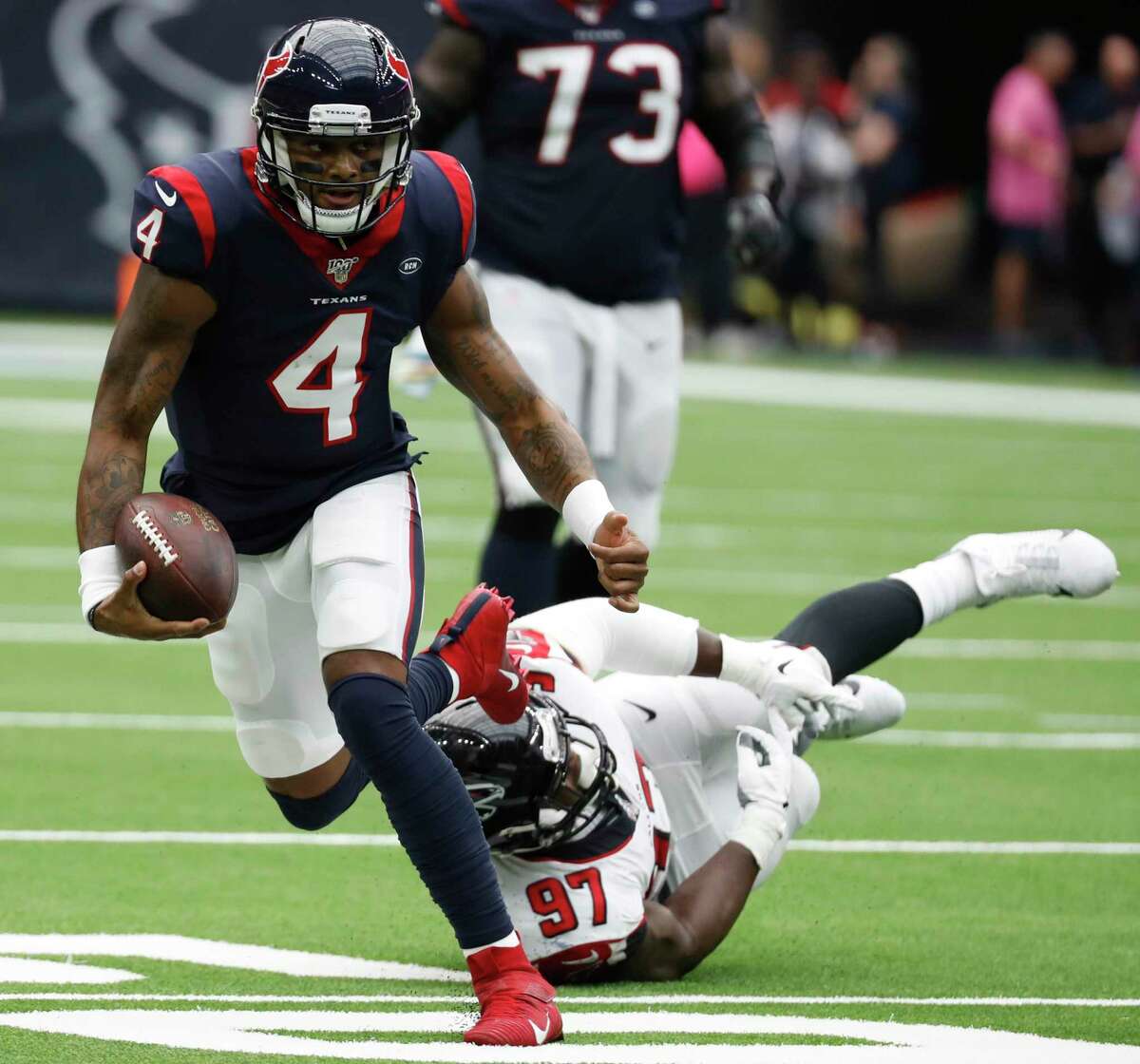 Texans quarterback Deshaun Watson, left, was untouchable, throwing for five touchdowns with a perfect passer rating of 158.3.