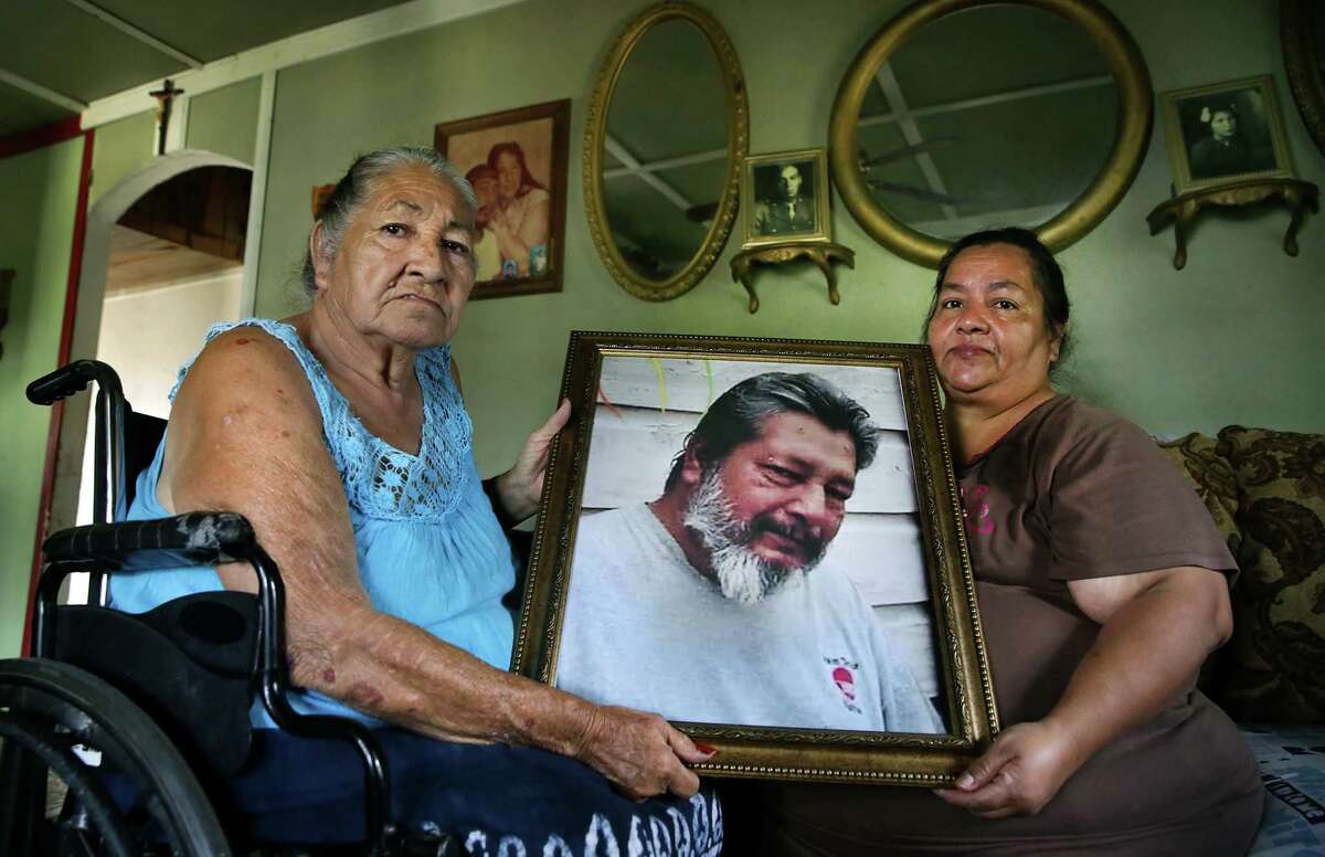 A picture of Narciso Ricarte Jr. is held by his mother, Oralia Ricarte, and sister, Oralia Guajardo. He was found dead at San Antonio State Hospital in June from what appears to be heart failure.