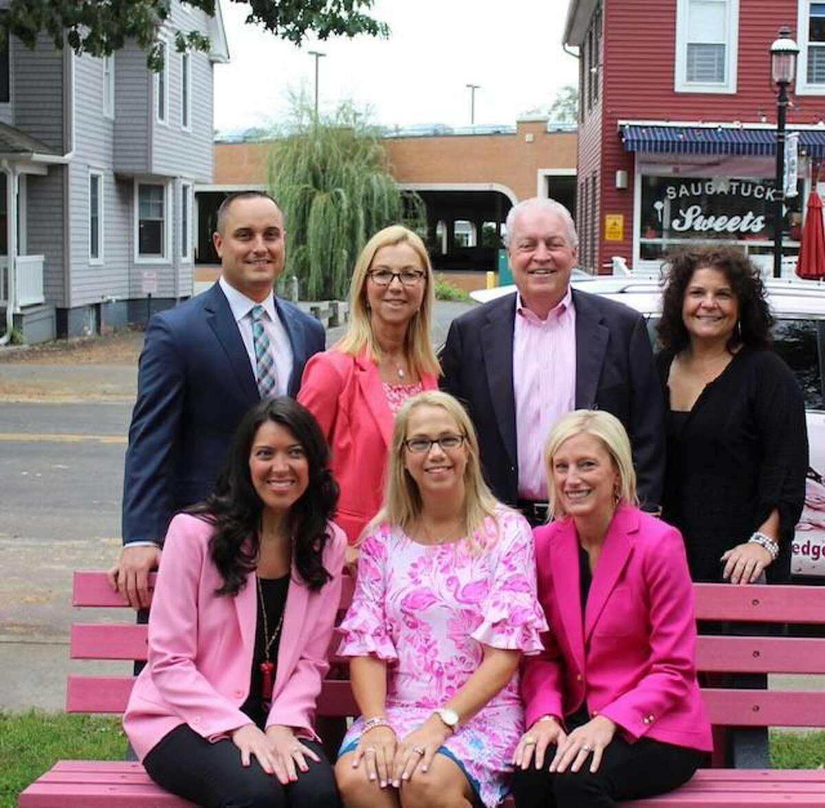 First Selectman Mike Tetreau and Parks and Recreation Director Anthony Calabrese joined Pink Pledge leadership in dedicating the town's new pink bench in Sherman Green.