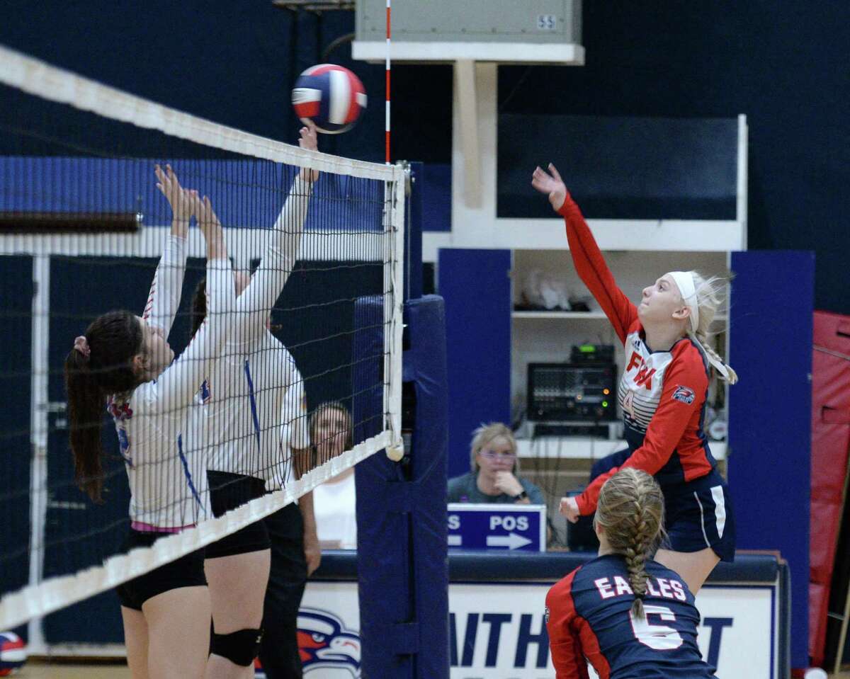 Grace Dubicki (4) of Faith West attempts a kill shot during the first set of a high school volleyball match between the Faith West Eagles and the Lutheran North Lions on Tuesday, October 1, 2019 at Faith West Academy, Katy, TX.