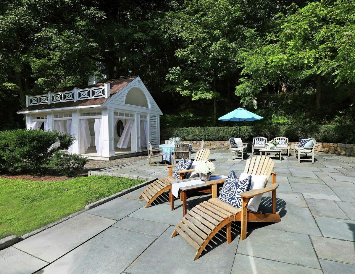 The backyard features a 1,000-square-foot bluestone patio and a cabana.
