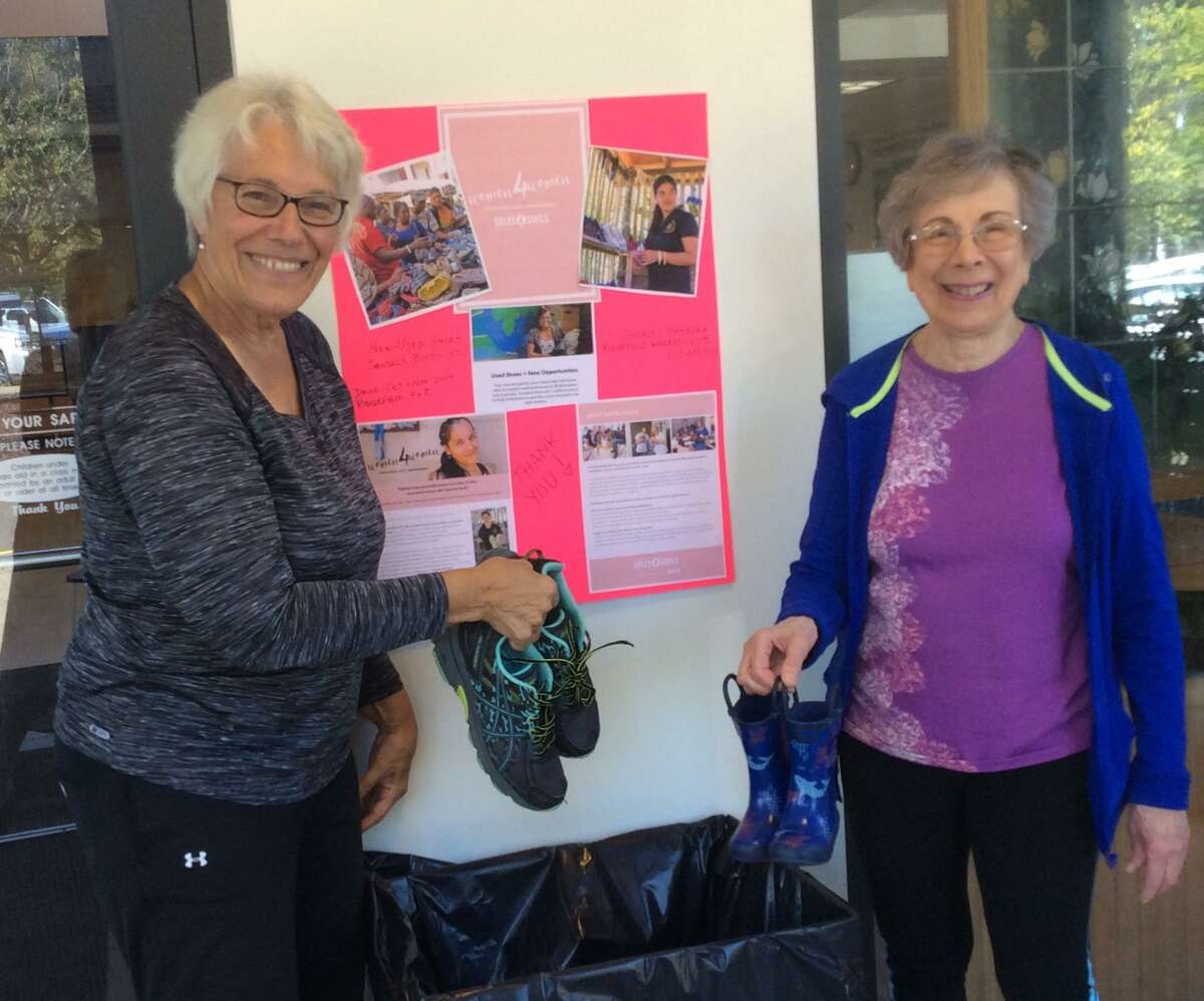 Barbara Carvalho and Susan Van Blarcom start the collection process at the Ridgefield Recreation Center.
