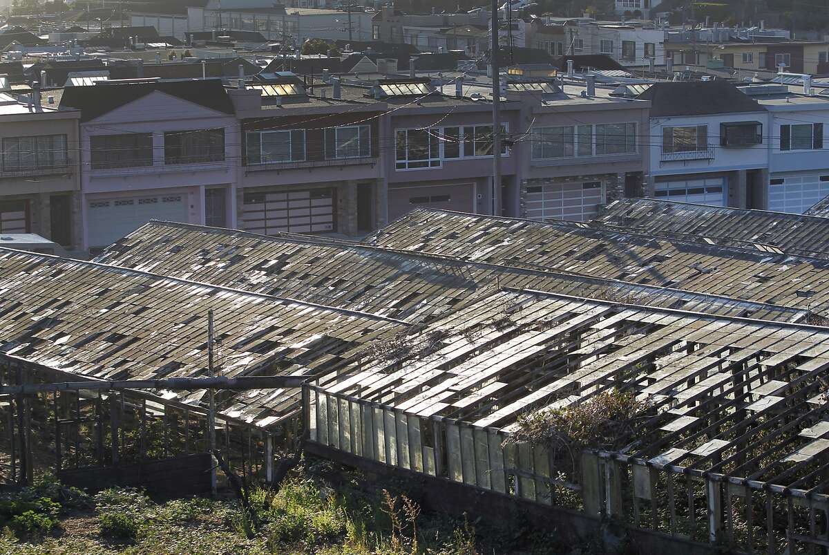 Decaying greenhouses are seen in the Portola district of San Francisco in 2015.