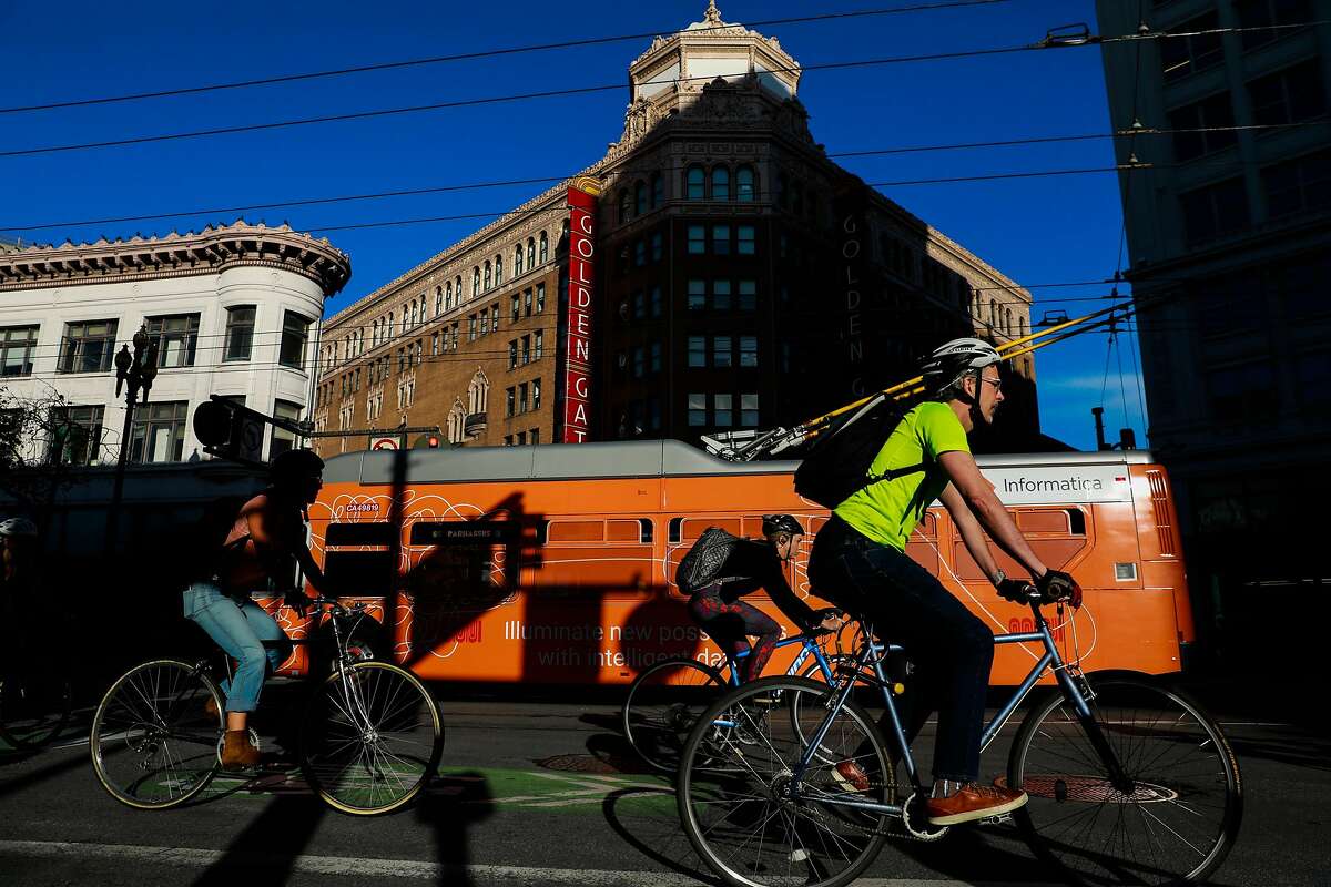 Commuters ride their bikes down Market Street in San Francisco, California, on Monday, Oct. 7, 2019.