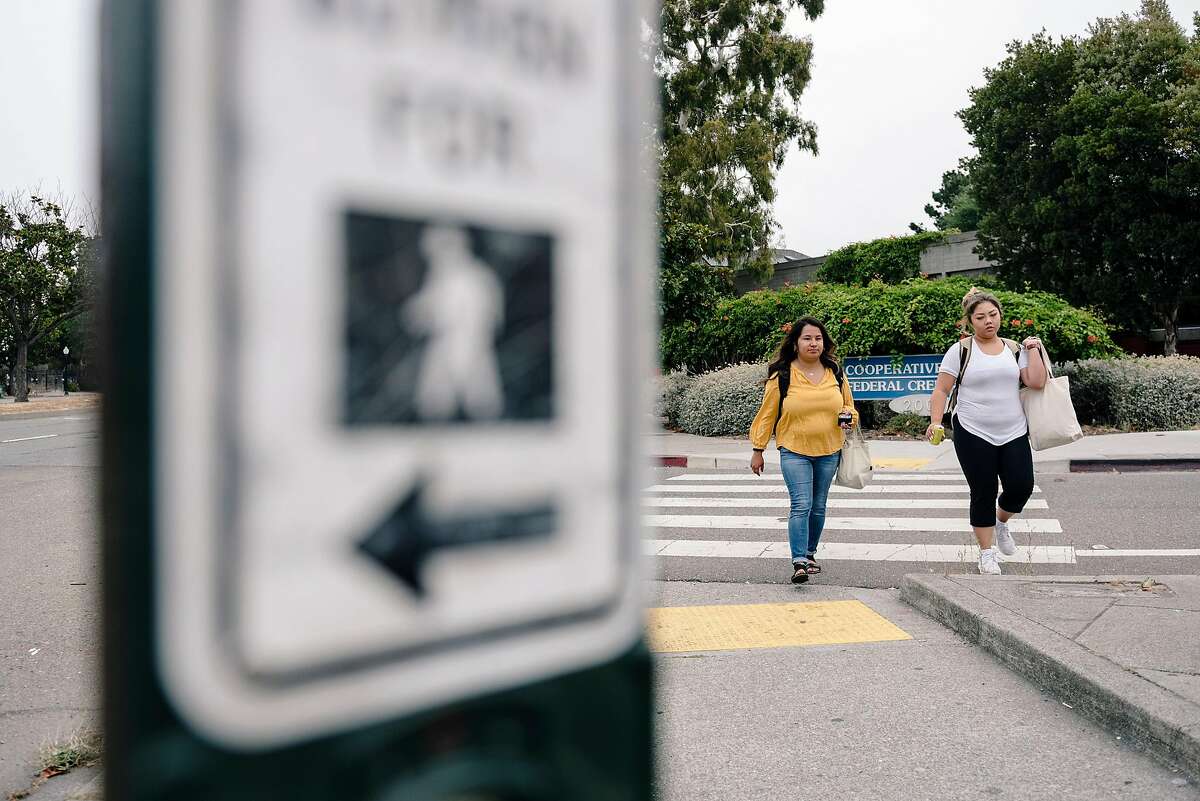 Lydia Lopez, left, and Cheena Amaranto walk across Ashby Avenue at Adeline Street in Berkeley, Calif., on Thursday, August 22, 2019.