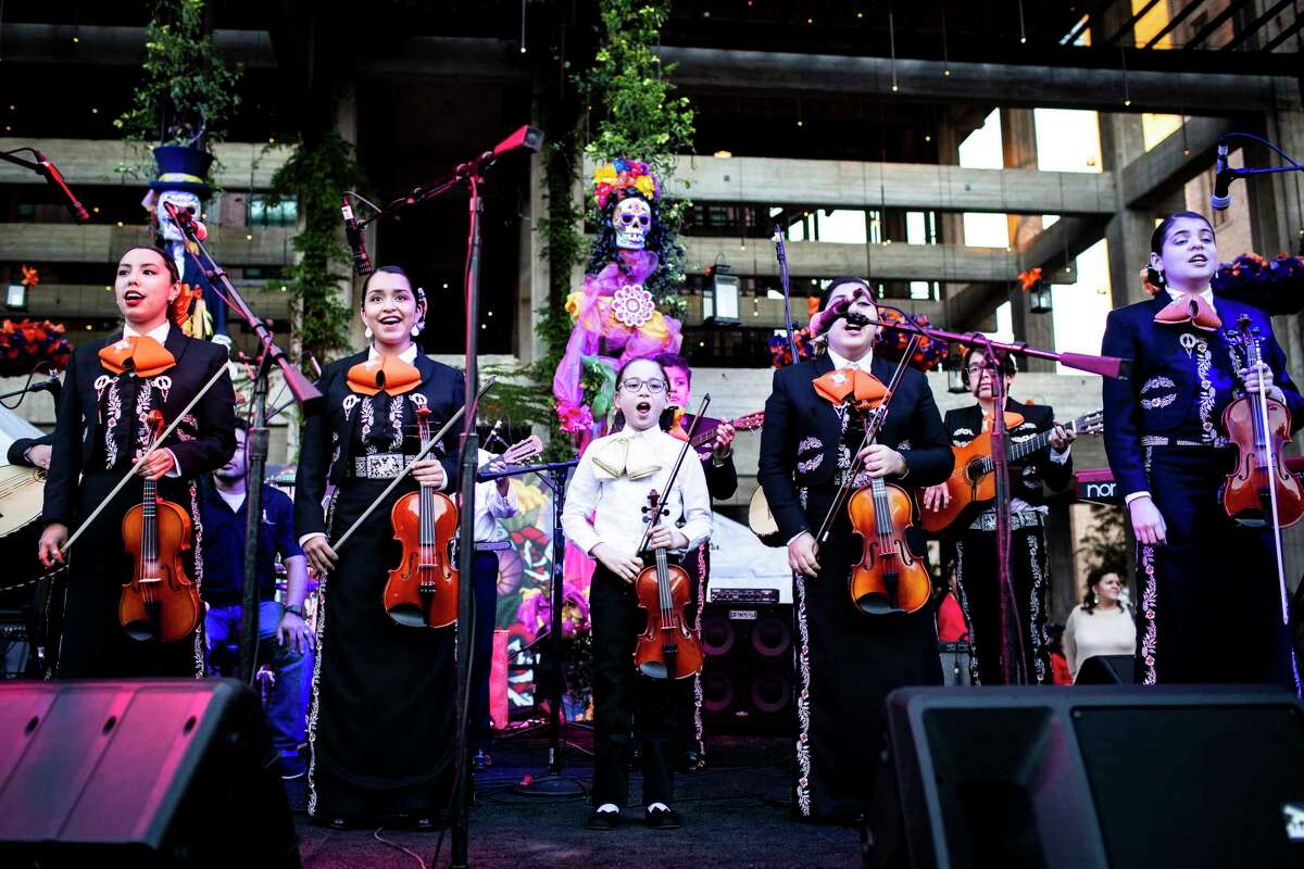 Young singers from the San Antonio Mariachi Academy perform onstage during the annual Dia de los Muertos festival at the Pearl on Friday, November 2, 2018.