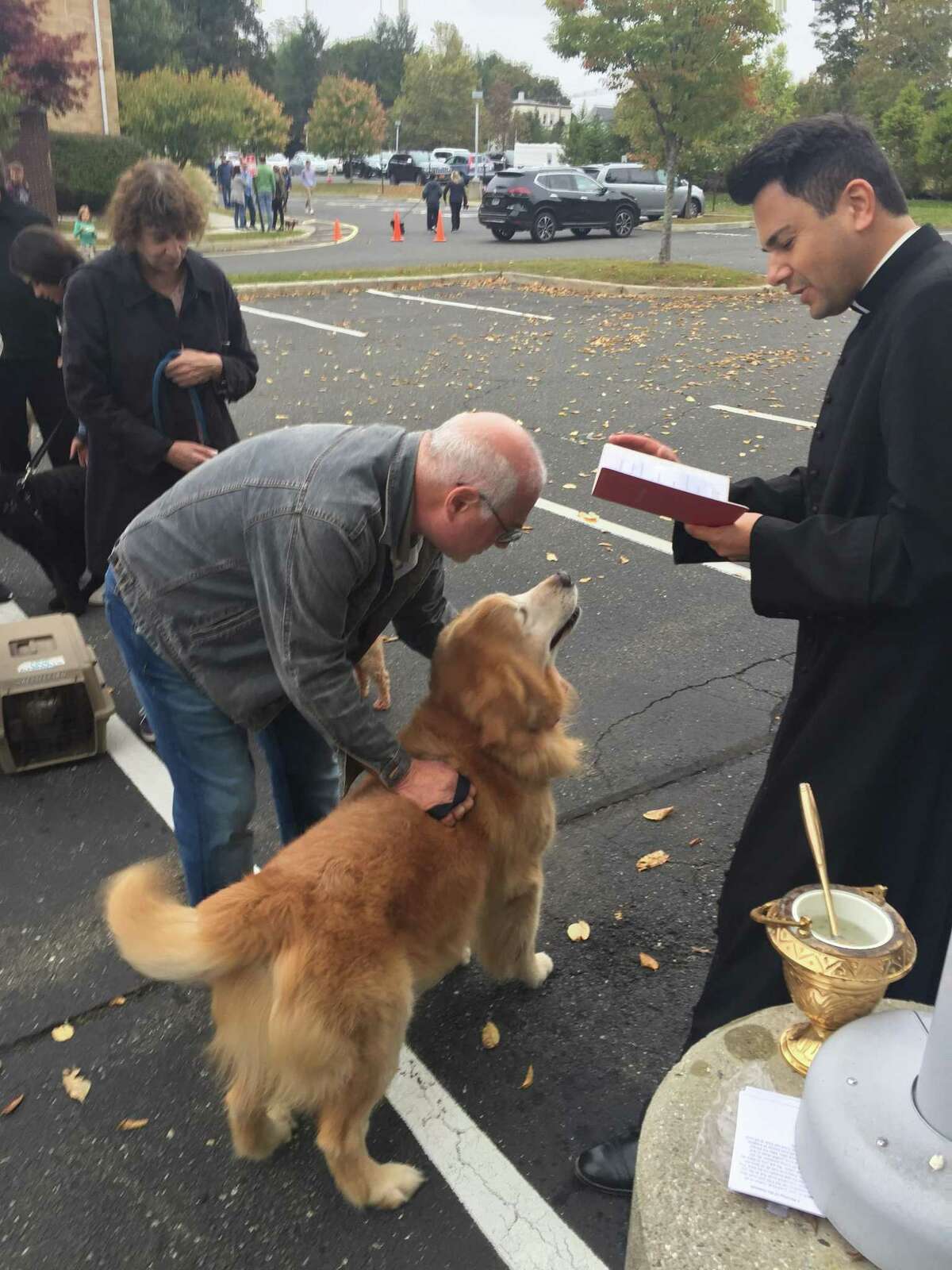 St. Mary’s new priest, Fr. Damian Pielisz, blessing pets.