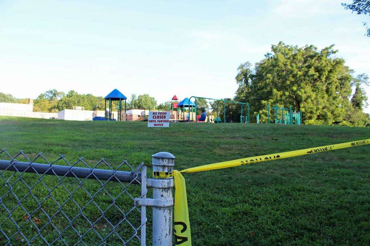 The walkway to the playground at Mill Hill Elementary School is one of eight sites closed for remediation.