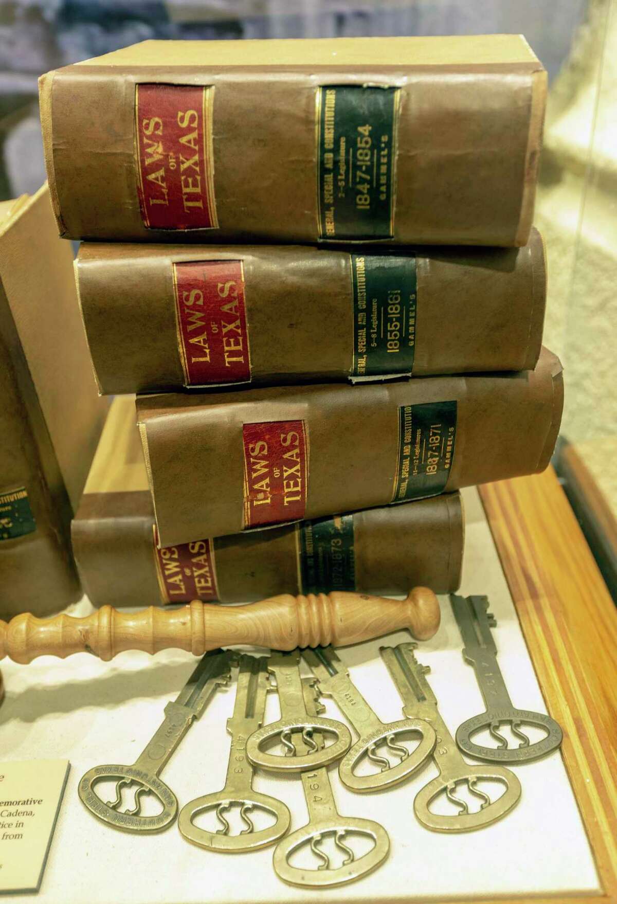 An exhibit seen Oct. 8, 2019 at the newly opened Bexar County Heritage Center in the Bexar County Courthouse exhibits old lawbooks and antique jail cell keys. The museum-like center features a series of exhibits that take visitors through the county's history.