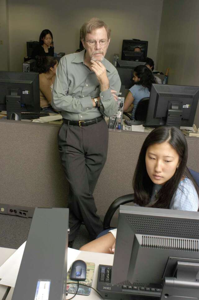 Mike Snyder, circa 2004, strokes his beard thoughtfully.