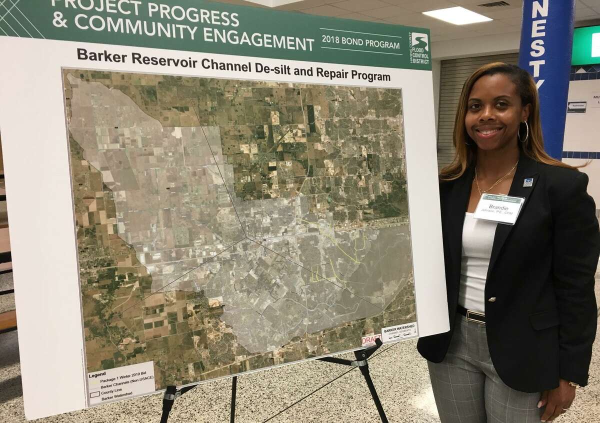 The Harris County Flood Control District plans to desilt more than 20 miles of two main channels in the Barker Reservoir — Mason Creek and Upper Buffalo Bayou and their tributaries. The yellow lines on the map show which channels will be part of the project. Brandie Johnson is the district's project manager.