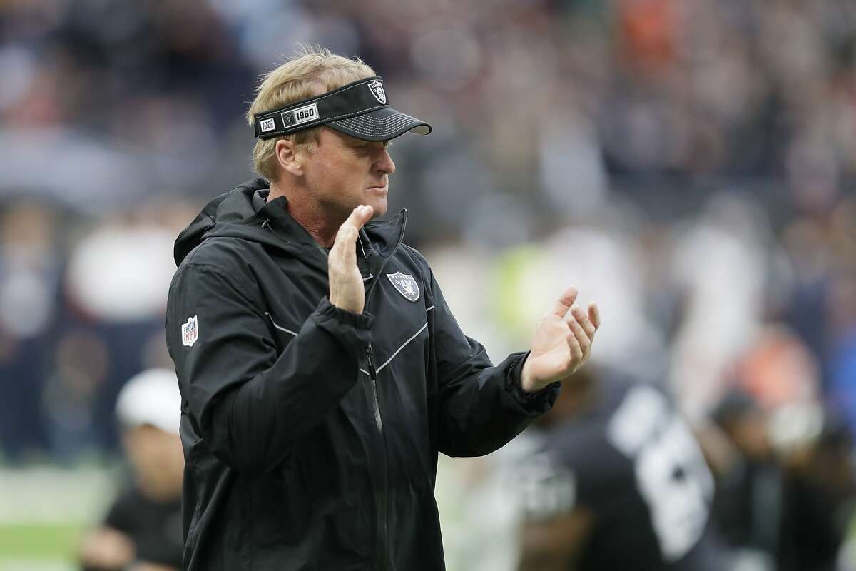 Oakland Raiders head coach Jon Gruden encourages his team as they prepare for an NFL football game against the Chicago Bears at Tottenham Hotspur Stadium, Sunday, Oct. 6, 2019, in London. (AP Photo/Kirsty Wigglesworth)