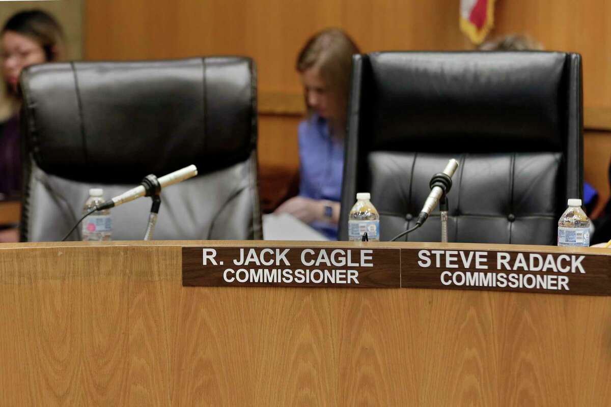 The chairs for county commissioners R. Jack Cagle and Steve Radack are empty on the dais after they did not appear for the Harris Co. commissioners court on Oct. 8, 2019 in Houston.