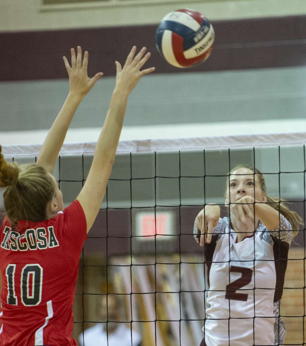 Lee High's Chasidee Trimble puts the ball out of reach of Tascosa's BB Irwin 10/08/19 at Lee High gym. Tim Fischer/Reporter-Telegram