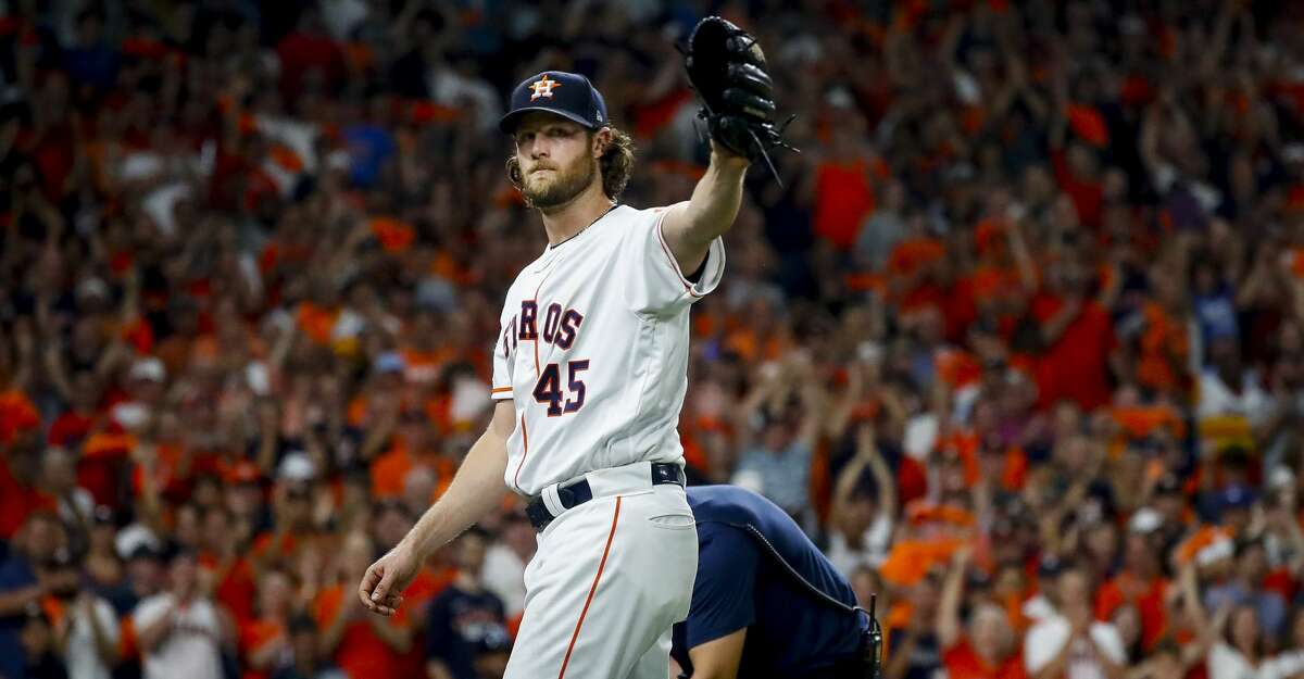 Houston Astros starting pitcher Gerrit Cole (45) acknowledges the crowd as he leaves the field after setting a new post-season franchise record for strikeouts during the eighth inning of Game 2 of the American League Division Series at Minute Maid Park on Saturday, Oct. 5, 2019, in Houston.