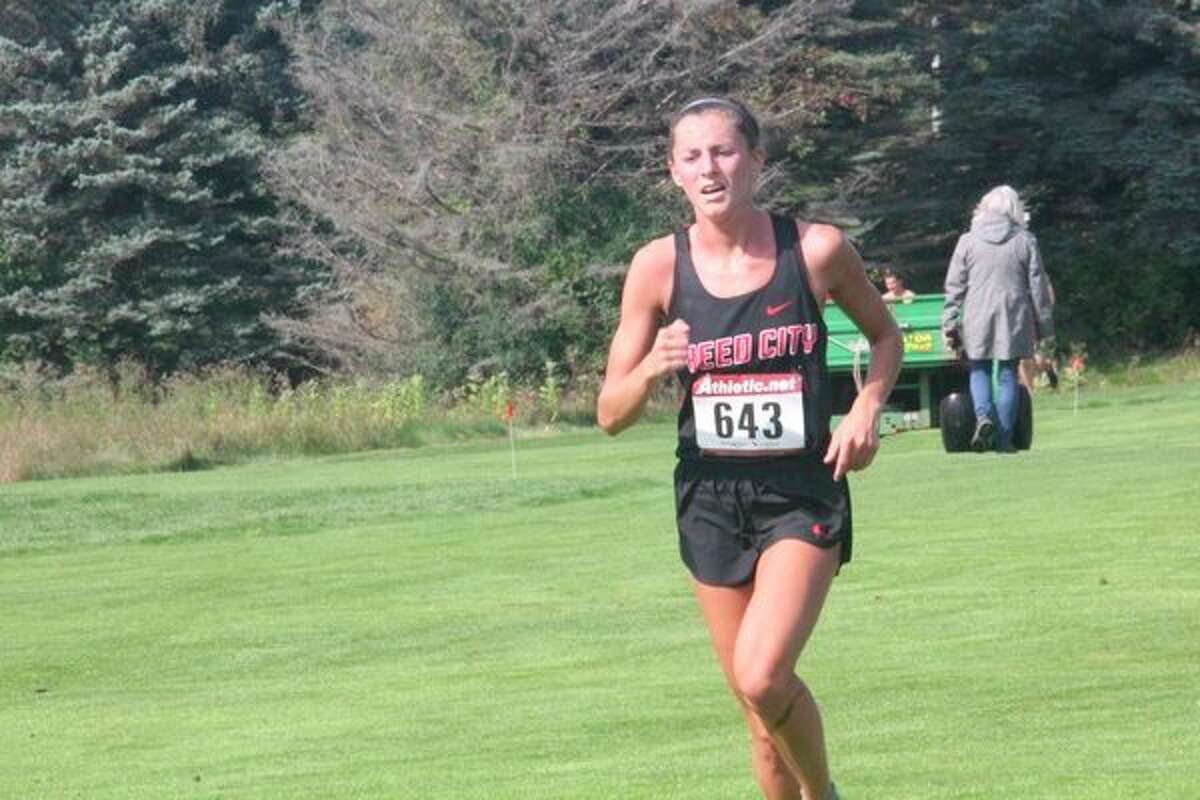 Reed City's Taylor Harrison makes her way toward the end of a recent cross country race. (Herald Review photo file)