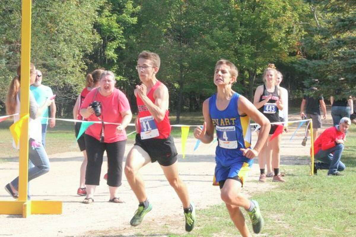 Evart's Kincade DuBreuil works on his pace during the final stretch of the Evart Invitational. (Herald Review photo/John Raffel)