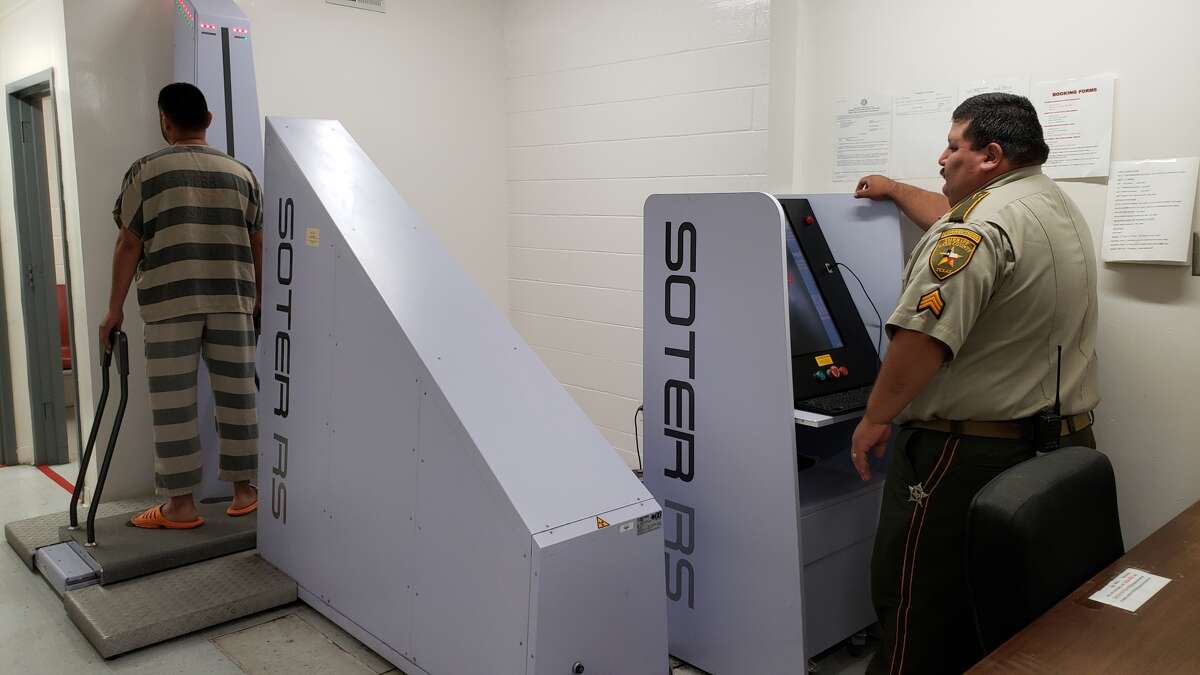 Sgt. Luis Ramos performs a full body X-ray scan on an incoming inmate at the Webb County Jail. Each inmate is scanned to keep contraband out of the jail. On Tuesday, the Webb County Sheriff’s Office announced the arrest of 39 people who tried to smuggle narcotics into the jail.