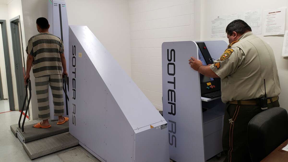 Sgt. Luis Ramos performs a full body X-ray scan on an incoming inmate at the Webb County Jail. Each inmate is scanned to keep contraband out of the jail. On Tuesday, the Webb County Sheriff’s Office announced the arrest of 39 people who tried to smuggle narcotics into the jail.
