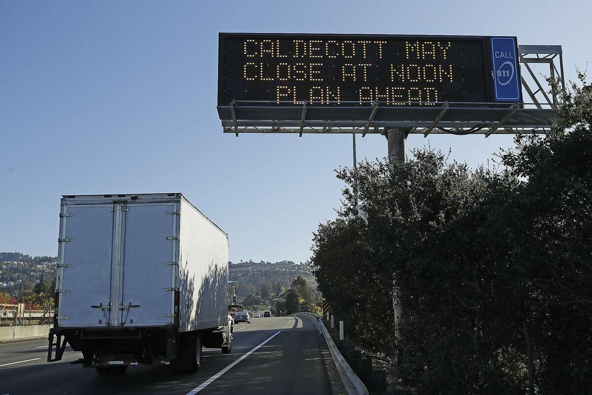 Signage warning of possible closure of the Caldecott Tunnel is seen on eastbound highway 24 on Wednesday, Oct. 9, 2019, in Oakland, Calif. Pacific Gas & Electric has cut power to more than half a million customers in Northern California hoping to prevent wildfires during dry, windy weather throughout the region. (AP Photo/Ben Margot)